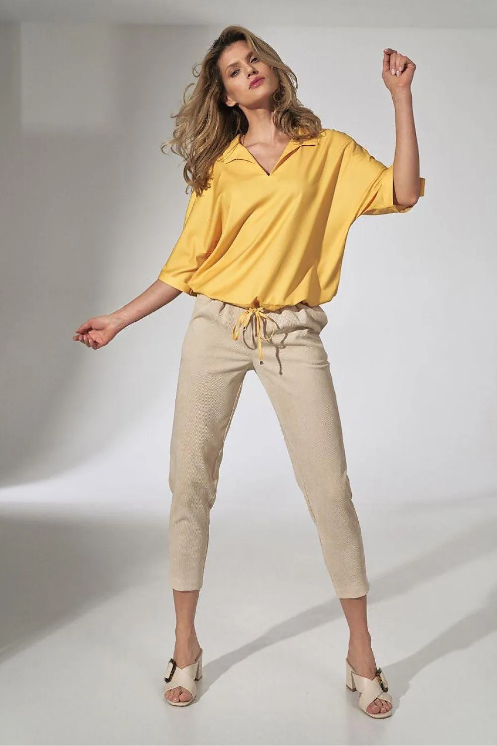 Chic Beige Corduroy Trousers with Elegant Pleats and Tapered Fit